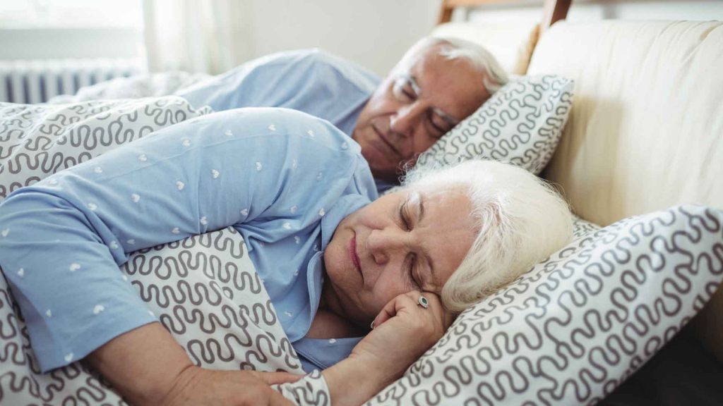 Senior couple sleeping.