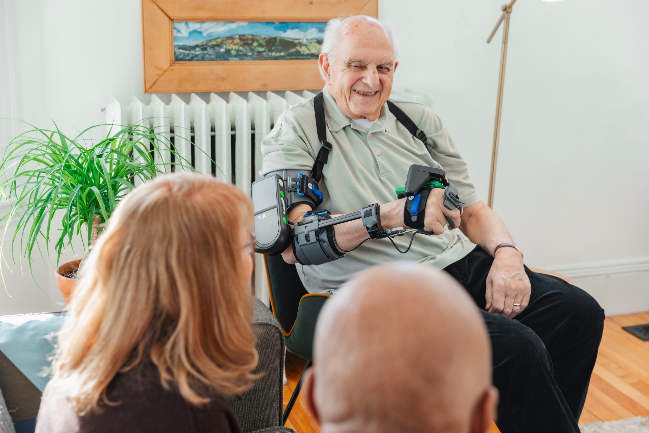 Myomo patient using upper-limb technology